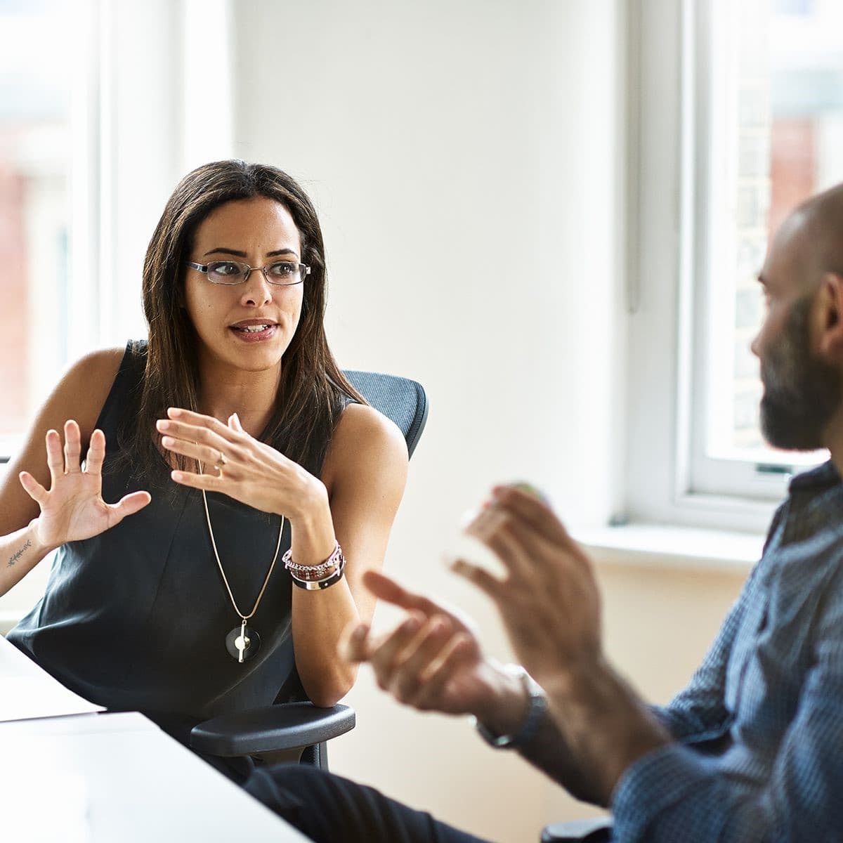 Two employees discussing their absence management.