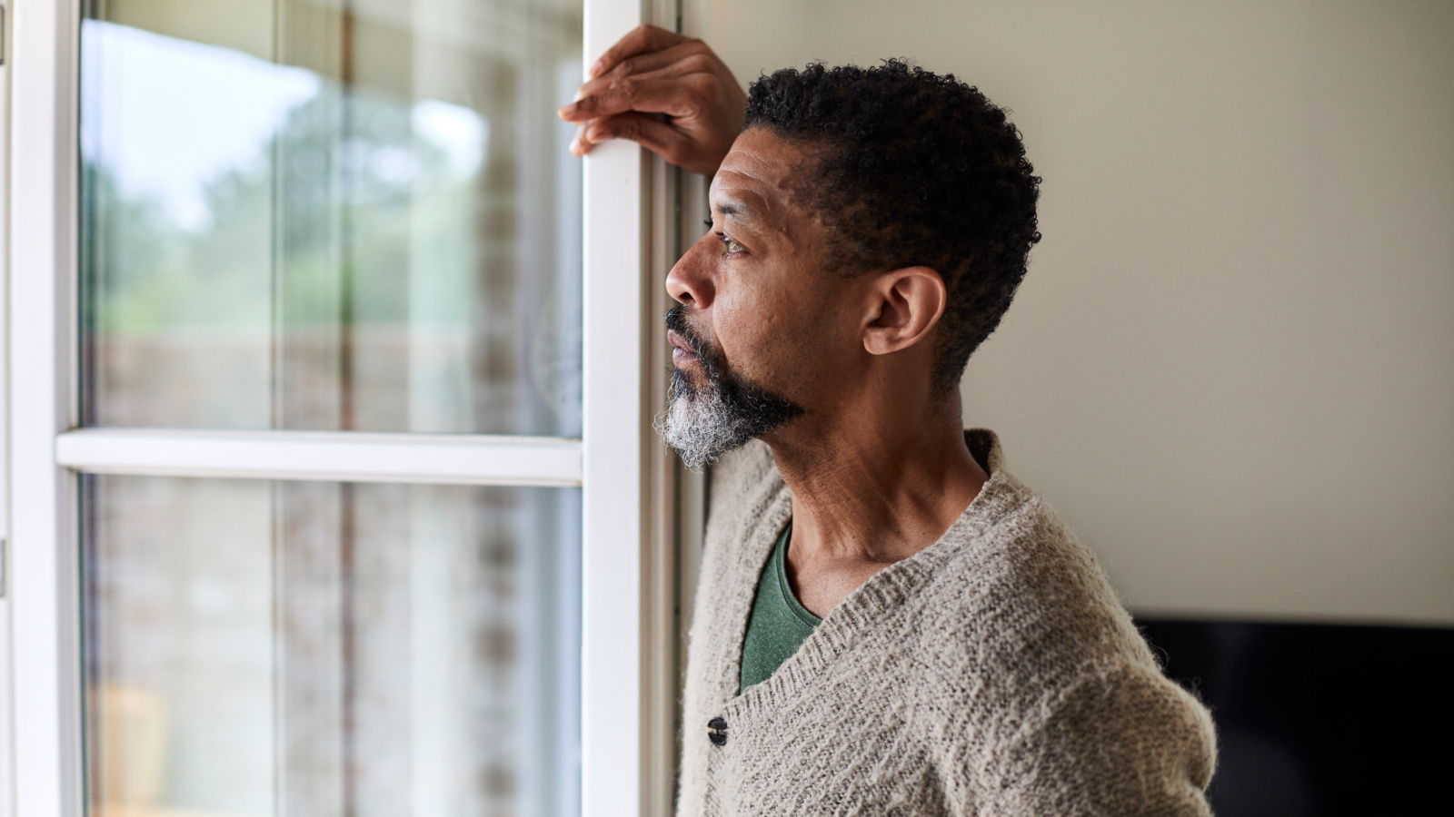Man looking out of window