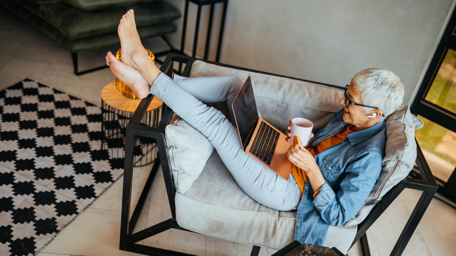 woman researching her retirement needs on the laptop