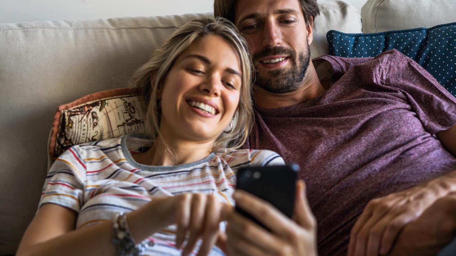 Couple looking at smartphone
