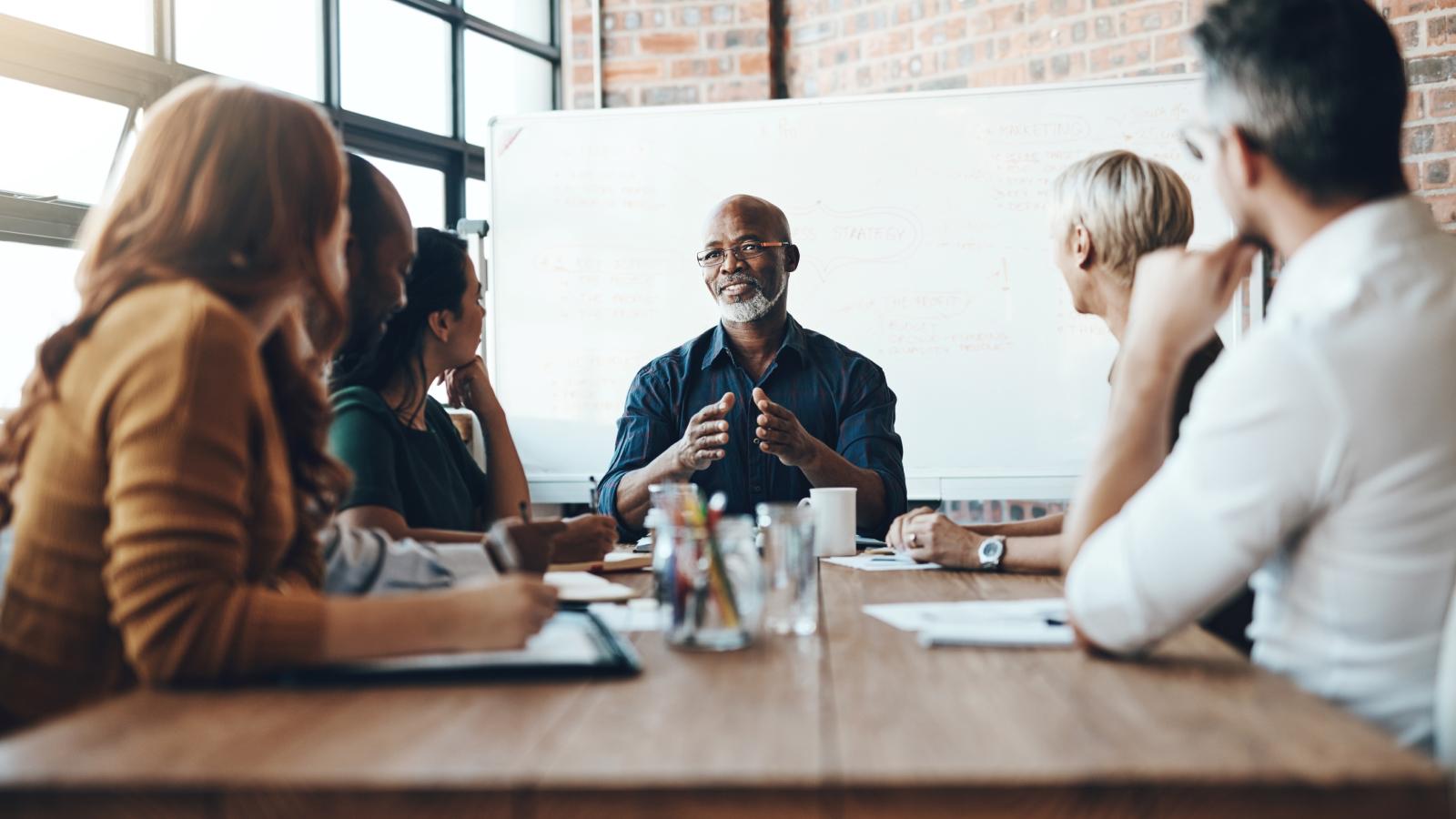 Businessman leading a meeting in boardroom