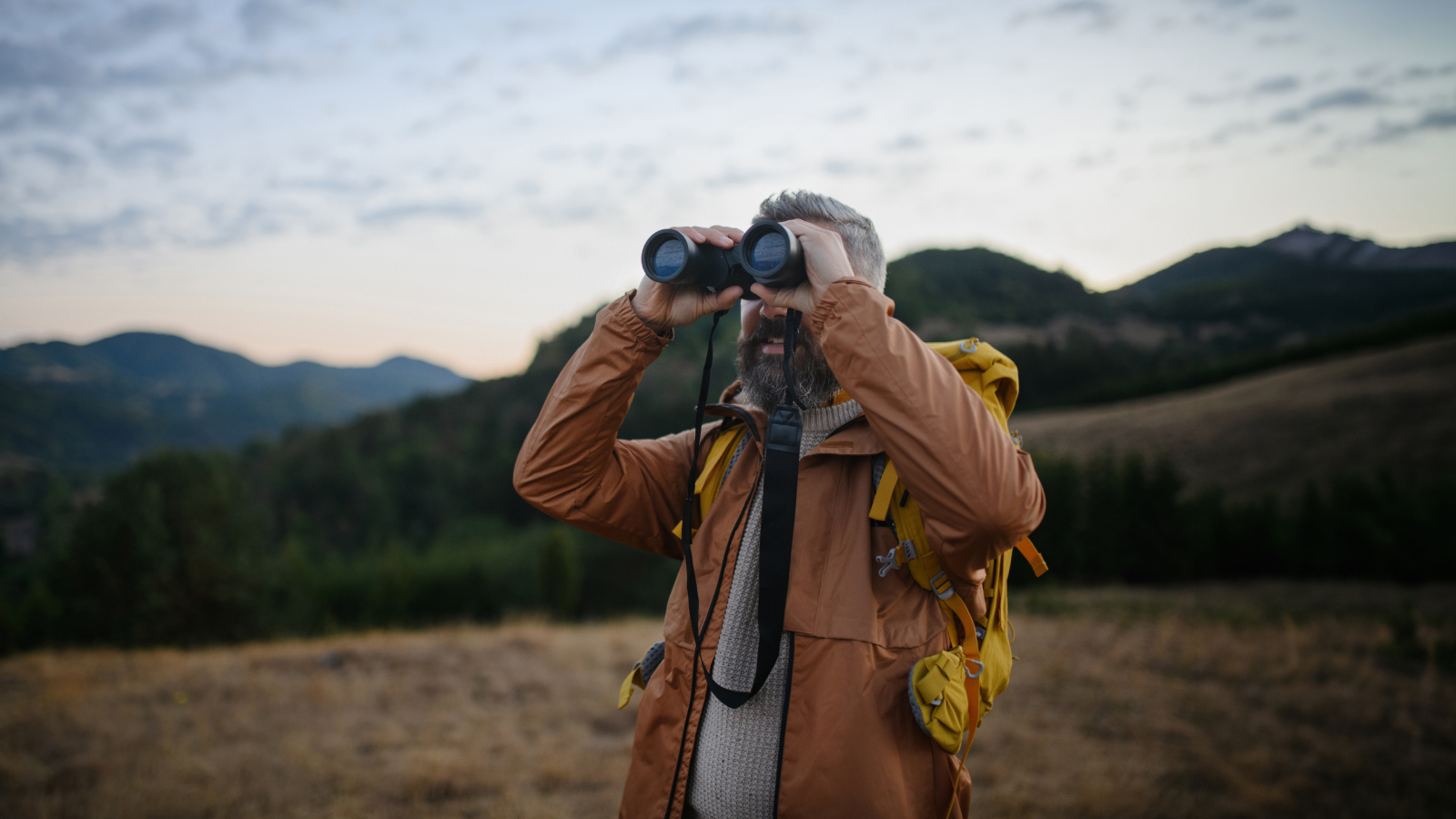Man hiking in nature and enjoying view