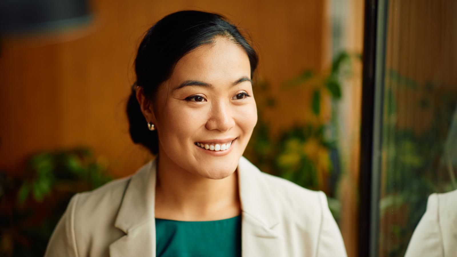 Professional woman smiling outside her office
